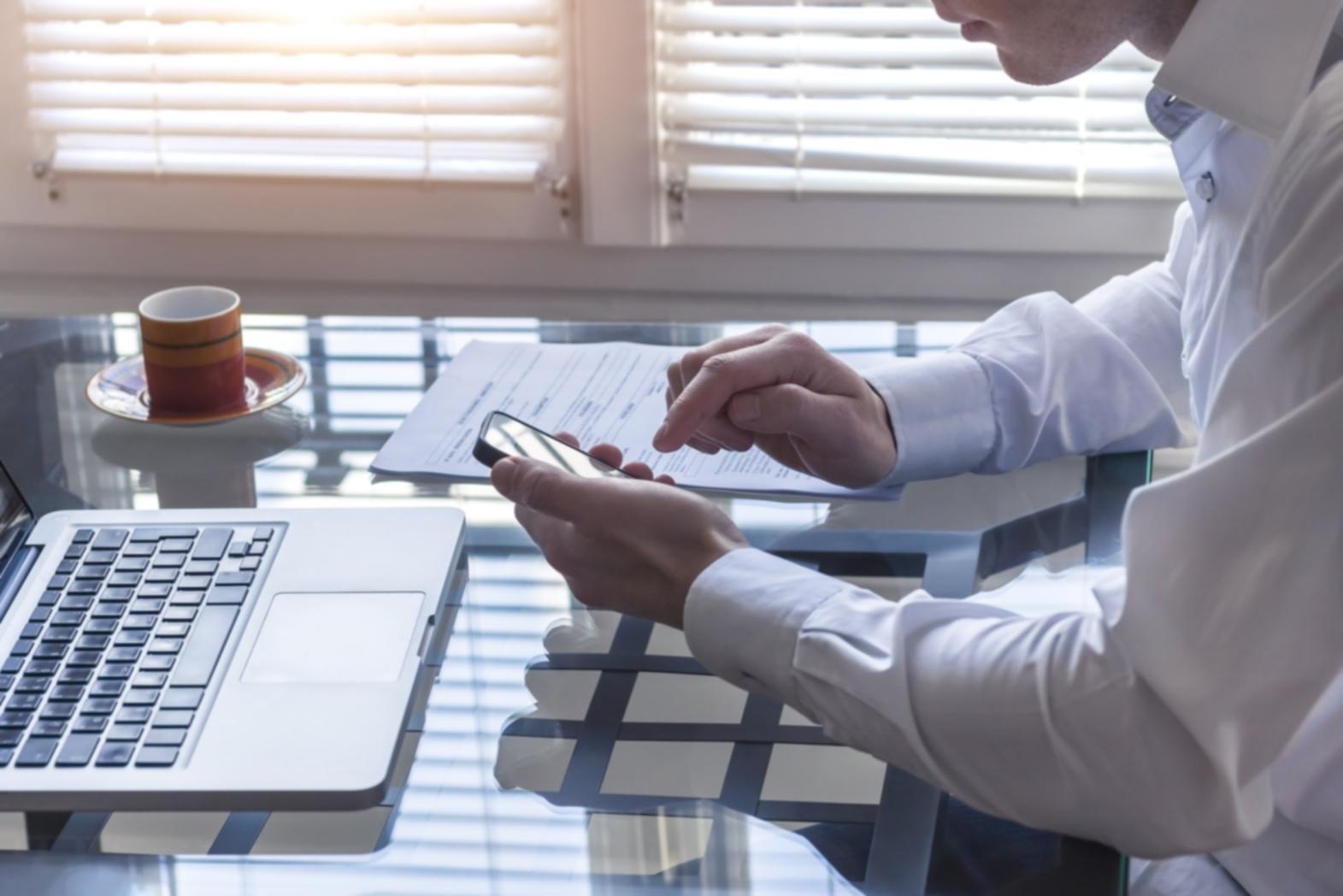 Researcher reviewing business adaptation study materials